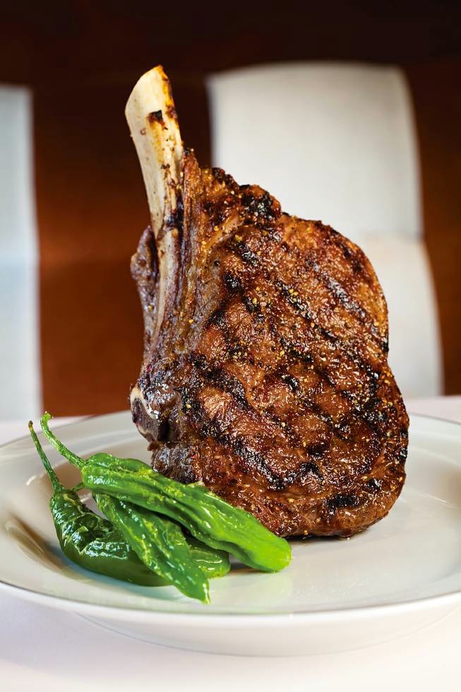 Bone-in ribeye broiled over the open charcoal pit